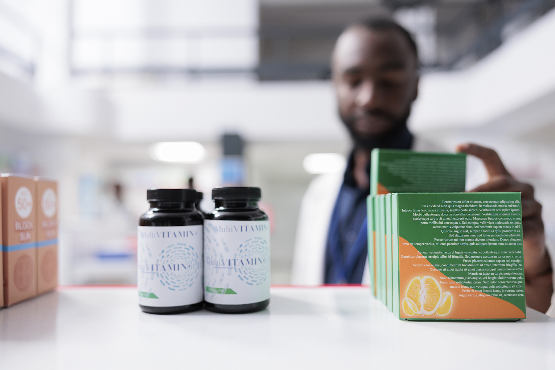 A pharmacist arranging supplement products in a retail store.